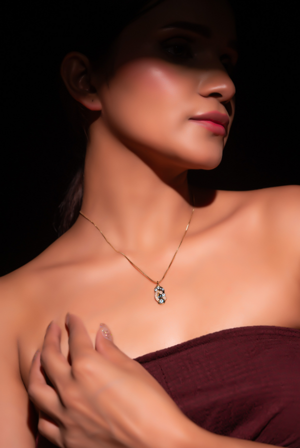CP-130 Chain Pendent decorated with multiple blue evil eye motifs